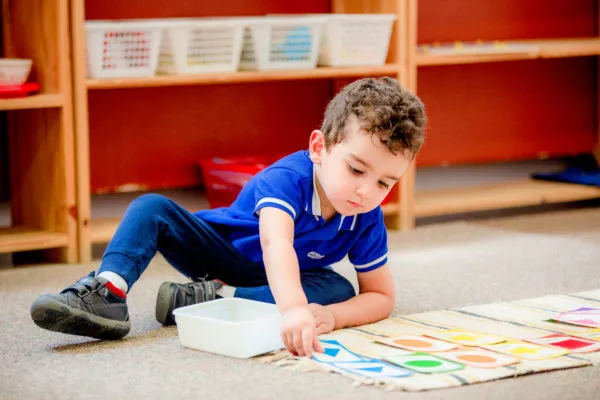 Child engaging with Montessori learning materials
